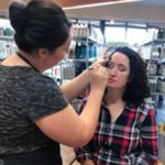 Makeup Artist Applying Color to a client