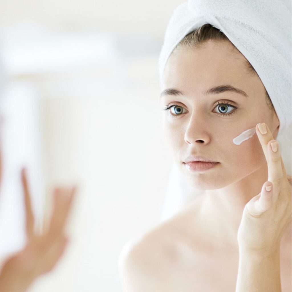 woman applying skincare