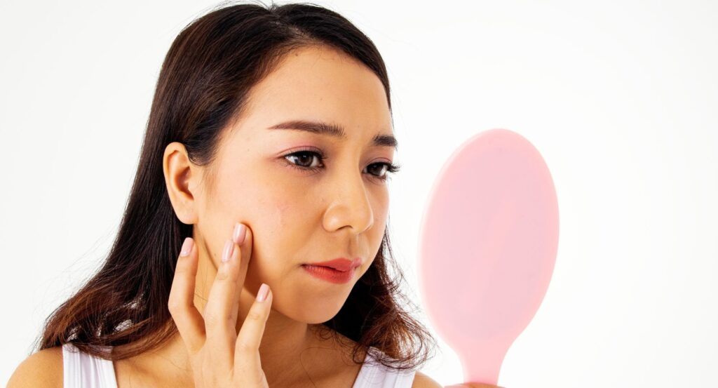 woman looking in the mirror