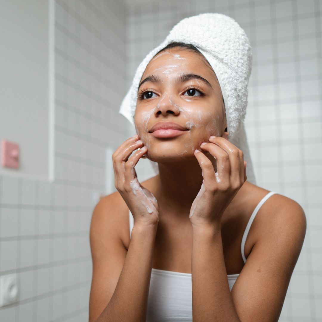 Woman gently cleansing face