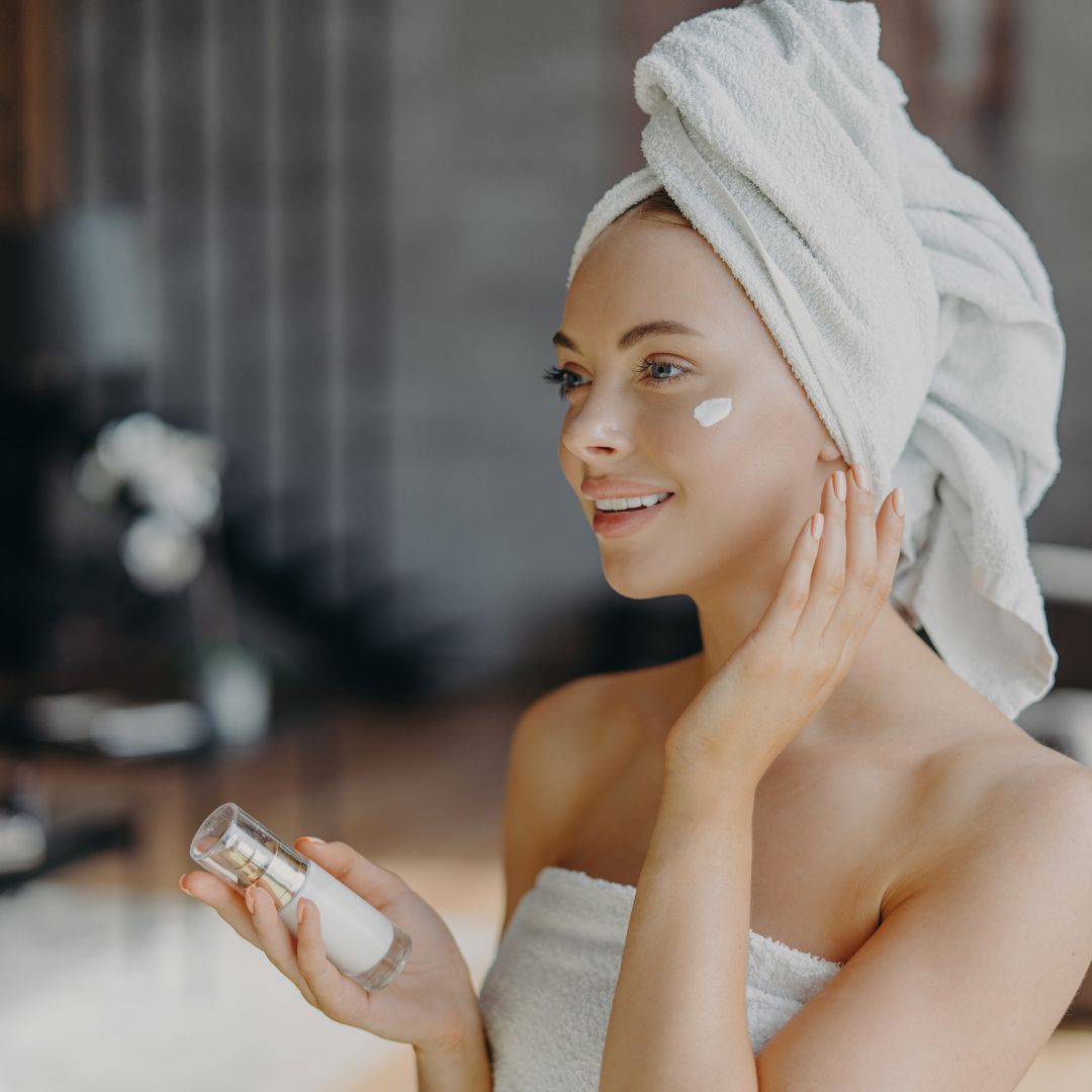 woman applying skin product