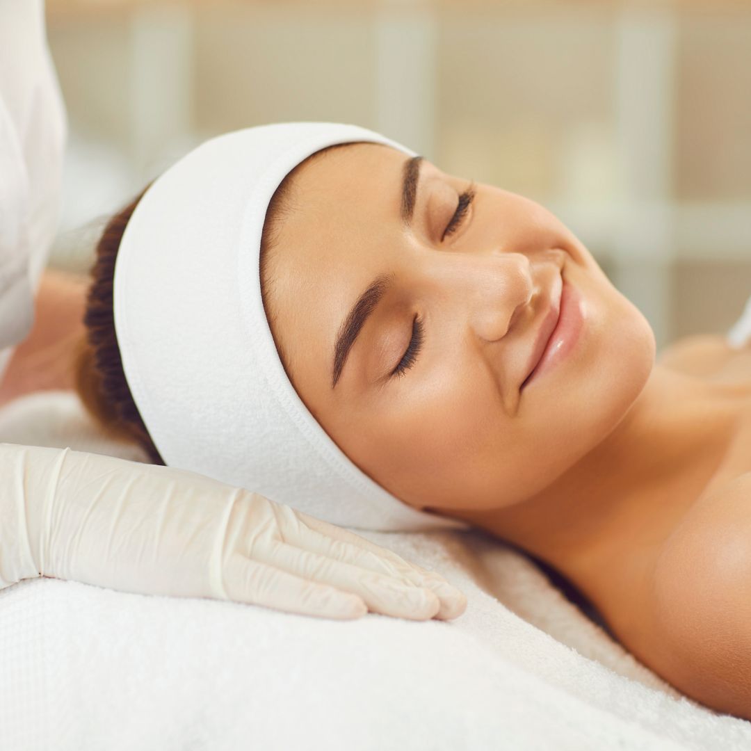 smiling relaxed woman during facial