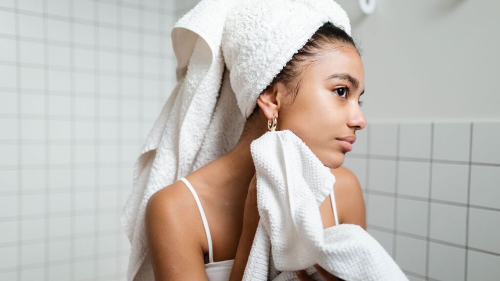 a woman drying her face