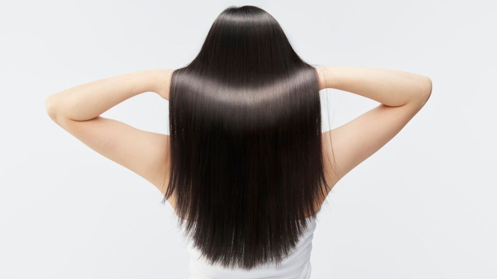 a woman with long straight hair