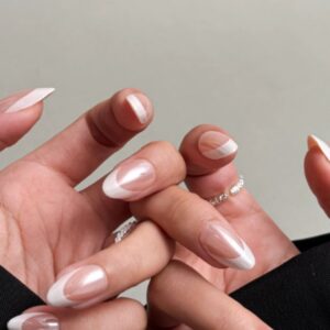 woman showings french tip nails